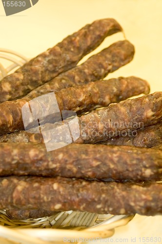 Image of sausage in wicker basket