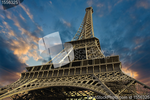 Image of Eiffel Tower at Sunset against a Cloudy Sky