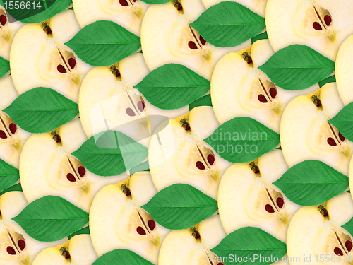 Image of background of apples slices and green leaf