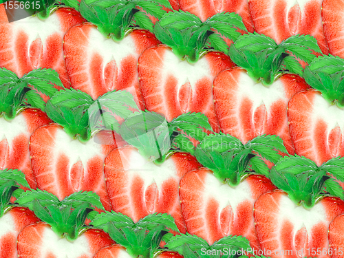 Image of Background of strawberry slices and green leaf