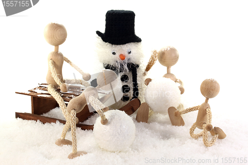Image of Families with children building a snowman