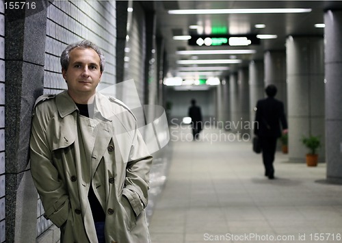 Image of Man in subway at night