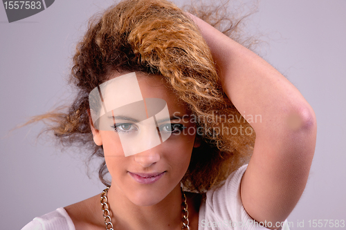 Image of Beautiful woman  with hands holding the hair