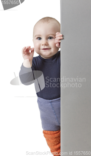Image of young child holding vertical sign