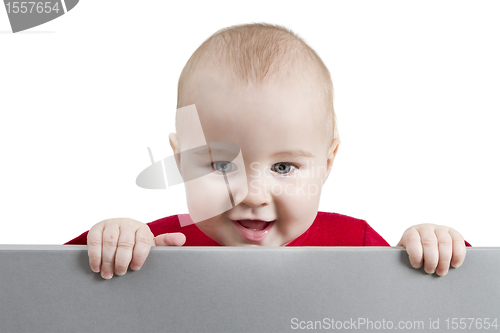 Image of young child holding shield