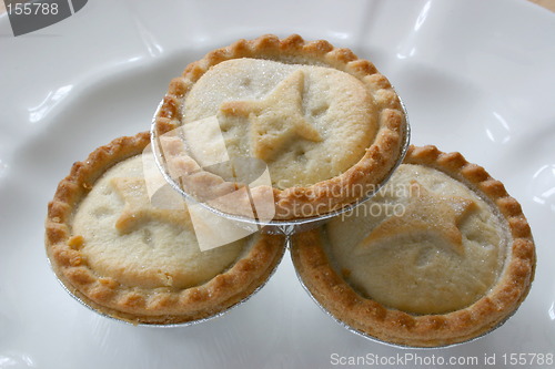 Image of three fruit pies stacked