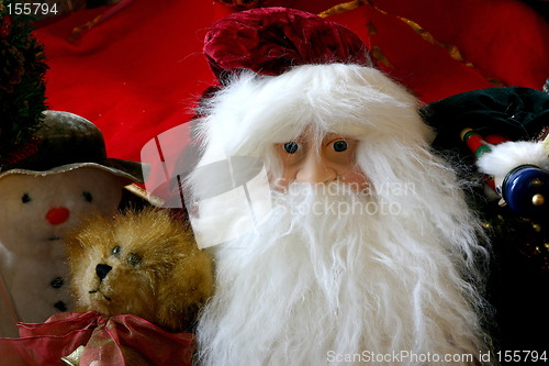 Image of santas face with a teddy