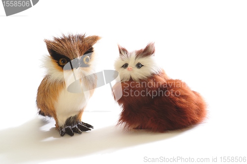 Image of Pair of cute fluffy toys: kitten and owl, isolated