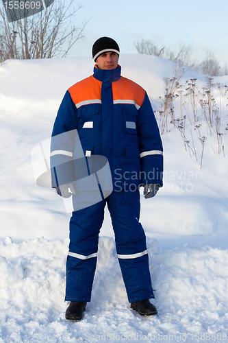 Image of Worker in the winter suit consisting of a jacket and trousers