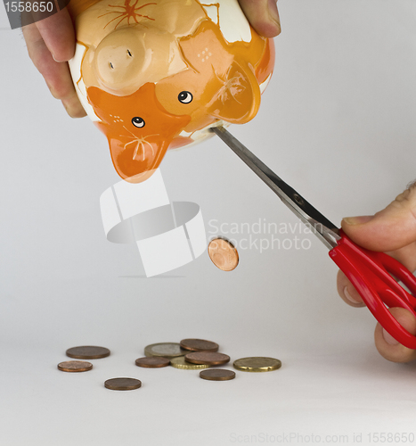 Image of getting money out of piggybank