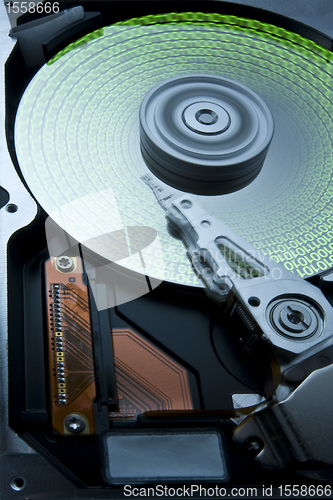 Image of hard disk with green data on platter -aah-