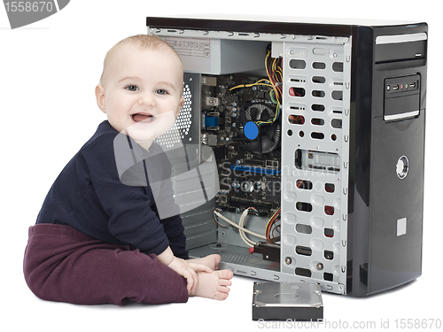 Image of young child with open computer