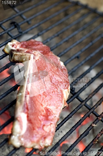 Image of thin sliced shell steaks on grill