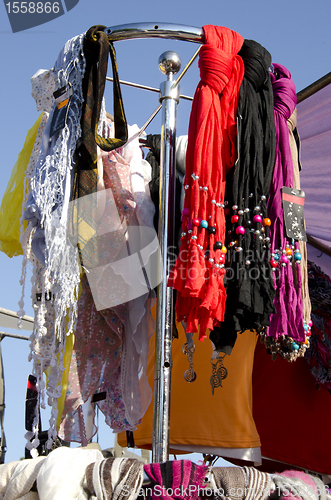 Image of Headscarf cloak and colorful scarves sell market 