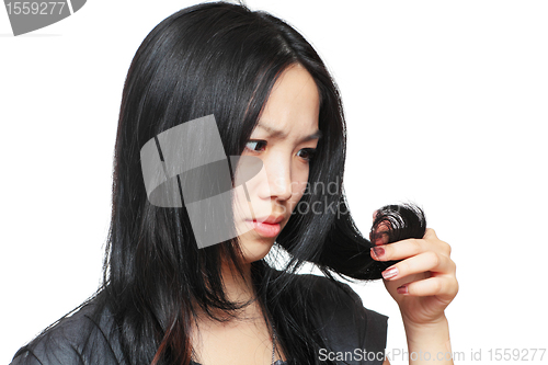 Image of Young woman have hair problem