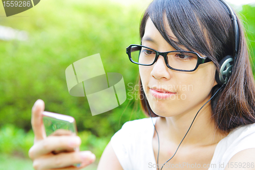 Image of young girl listening music