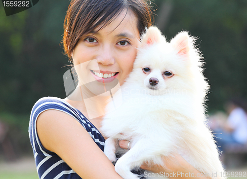 Image of Young girl with dog