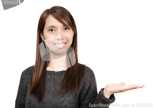Image of woman showing with hand