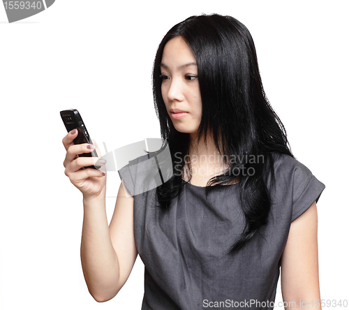 Image of girl sms on mobile phone