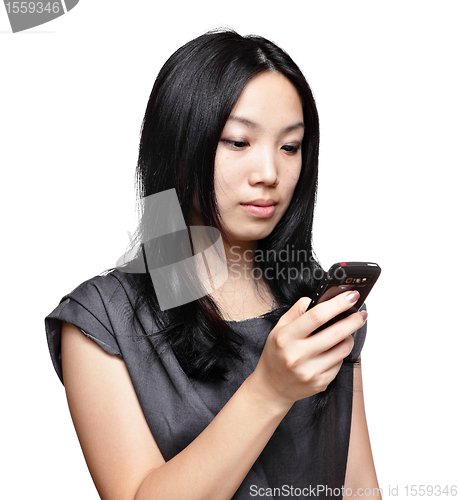 Image of girl sms on mobile phone