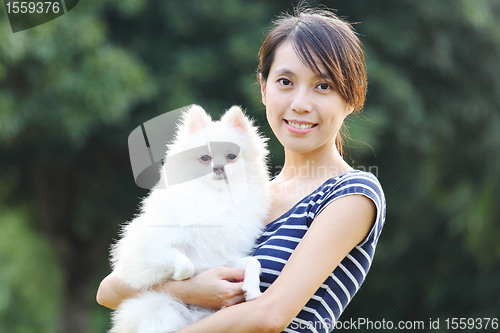 Image of Young girl with dog