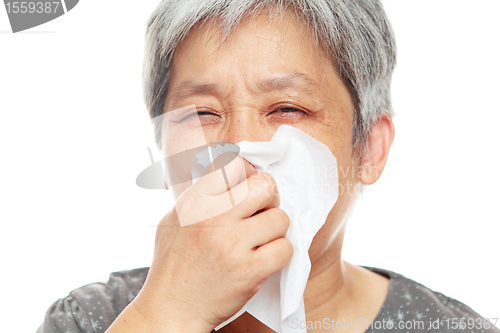 Image of sneezing woman