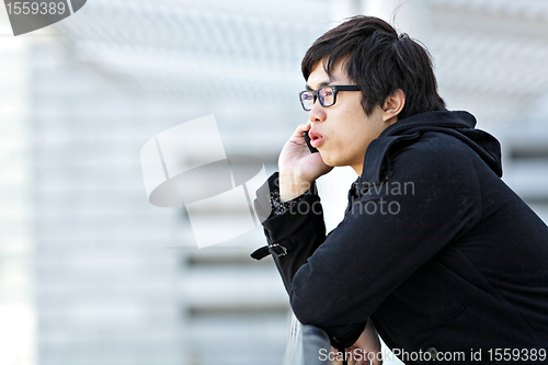 Image of man talking on mobile phone