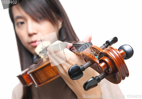 Image of Young woman playing violin