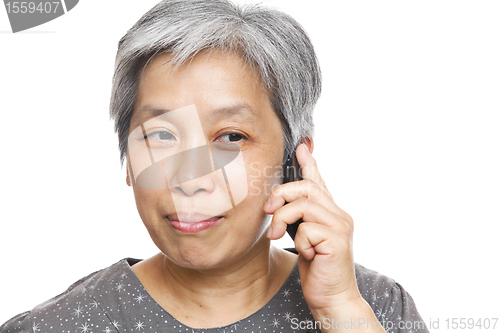 Image of mature woman using mobile phone