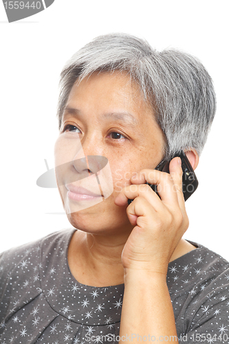 Image of mature woman using mobile phone