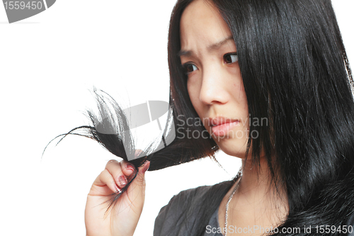 Image of Young woman have hair problem