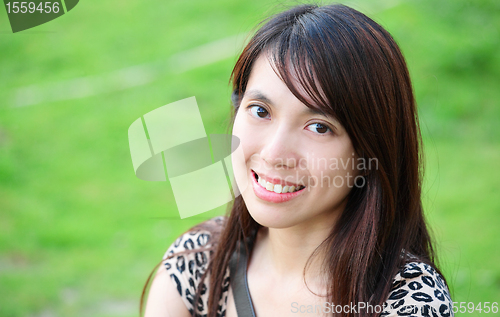 Image of young woman smiling friendly