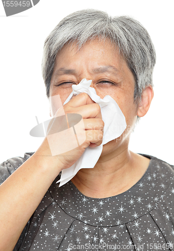 Image of sneezing mature woman