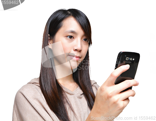 Image of girl sms on mobile phone