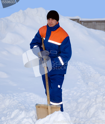 Image of The worker removes the snow
