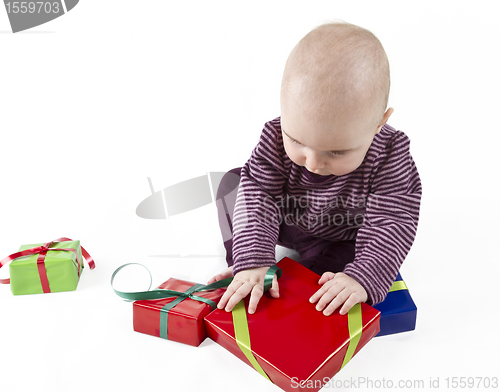 Image of young child unpacking presents