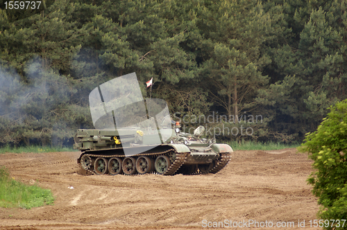 Image of tank driving on dirty ground