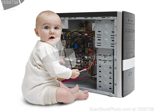 Image of young child working on open computer