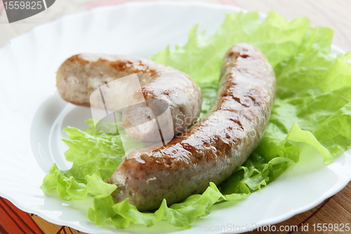 Image of two sausages on plate
