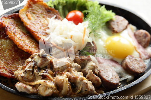 Image of meat with egg