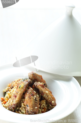 Image of Peaces of meat with millet