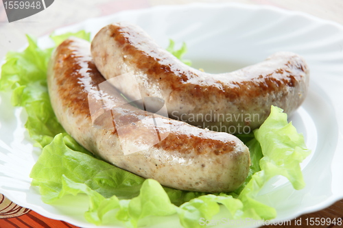 Image of two sausages on plate