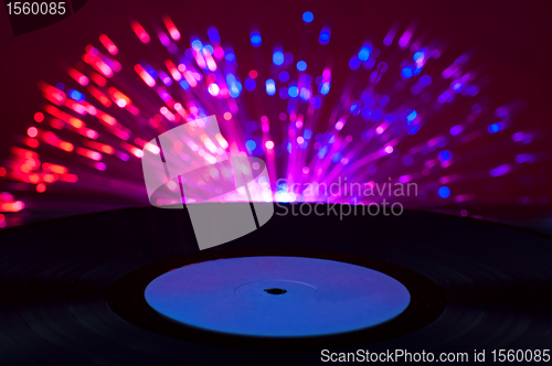 Image of LP vinyl record and disco lights