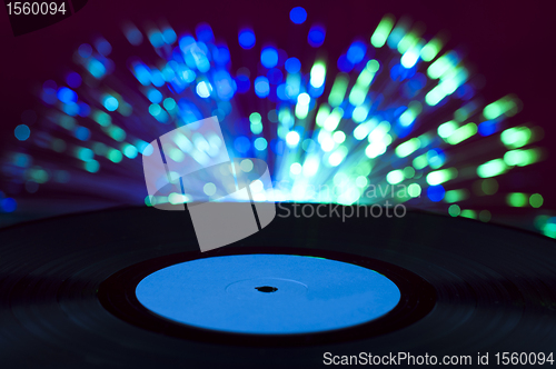 Image of LP vinyl record and disco lights