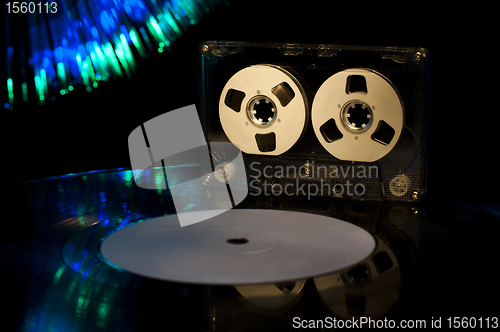 Image of LP vinyl record, cassette tape and disco lights