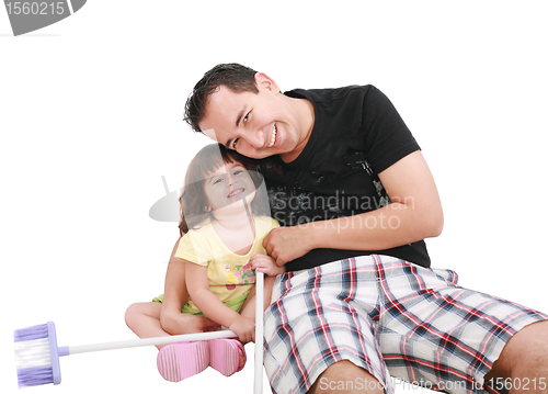 Image of Father and daughter playing together and looking camera