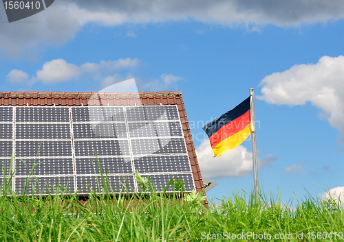 Image of Roof with solar panels and German flag