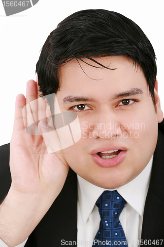 Image of Young business man listening something isolated on white background