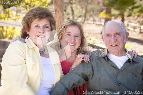 Image of Senior Couple with Daughter in the Park