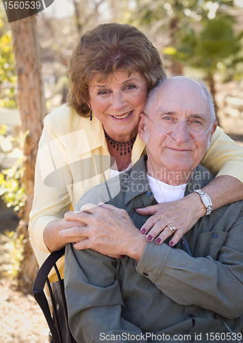 Image of Senior Woman with Man Wearing Oxygen Tubes